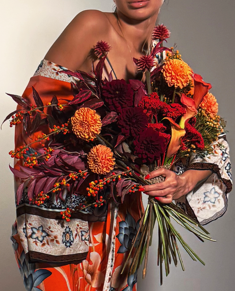 Editorial bouquet featuring seasonal autumn blooms in rich burgundy and copper tones