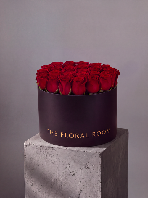 A structured dome of red garden roses in our signature matte box. Modern, sculptural floral design from The Floral Room, Hallandale Beach FL. Local delivery across Miami.