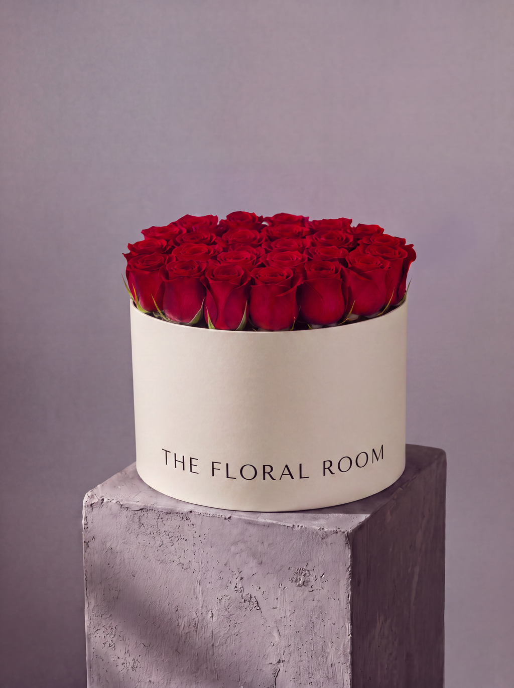 A structured dome of red garden roses in our signature matte box. Modern, sculptural floral design from The Floral Room, Hallandale Beach FL. Local delivery across Miami.