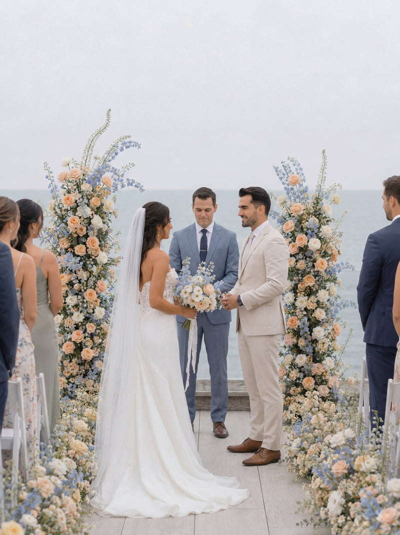 Outdoor wedding ceremony with floral aisle arrangements
